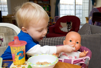 Ivan feeds his baby while a forlorn Digby watches on