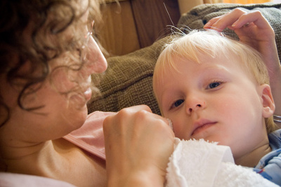 Being nursed back to health by Mama after a bump on the cheek