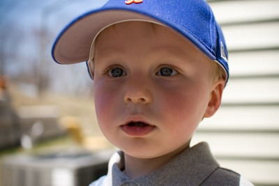 Finding relief under his Mets hat from the first summer-like sun of the year 