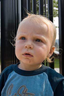Wondering why his sister would ever voluntarily get wet at the waterpark