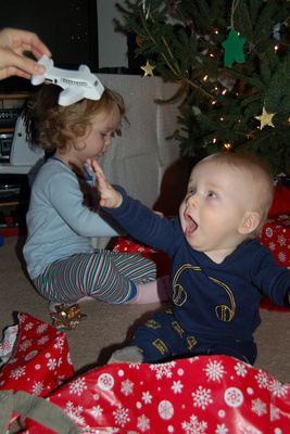Reaching for his first Christmas present