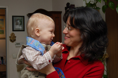 The birthday boy shares a quiet moment with his aunt before the festivities begin