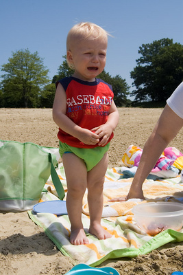 Not yet thrilled about the beach, just like his big sister at this age