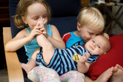 Enduring another round of 'entertainment' from his older siblings