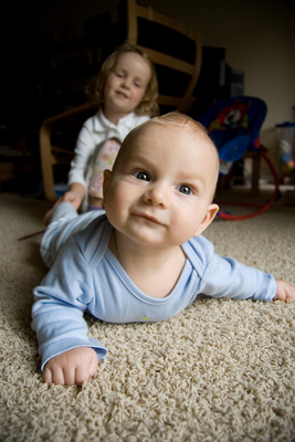 Being dragged around by his big sister