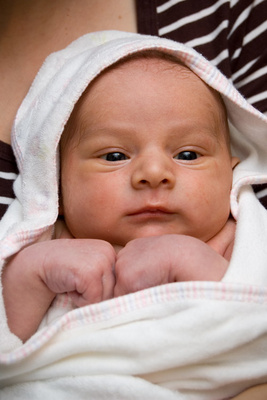 Curled up in a warm towel in Mama's arms