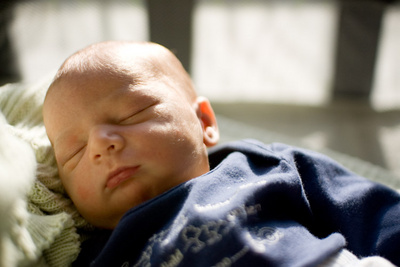 Trying (and failing) to give him the signal that the sun means it's time to be awake
