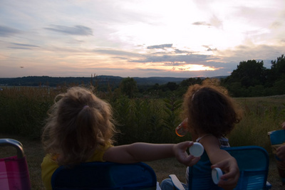 Waiting for the fireworks to begin, Veronika and friends can't be bothered with keeping track of their own bottle caps