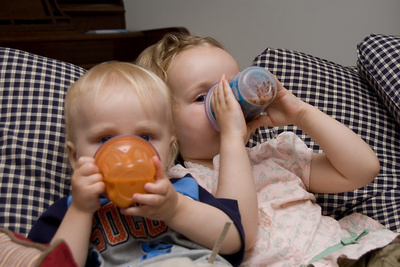 Peering out over their chocolate milk