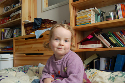 Satisfied with the new sleeping arrangements (her bed in Mama and Papa's room)